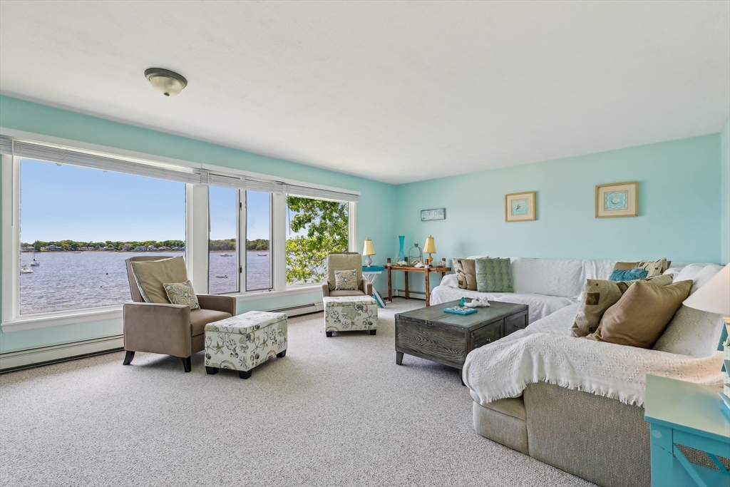 57 Oak Street Wareham, MA 02571 - Photo 7 of 42 a bedroom with furniture and a large window