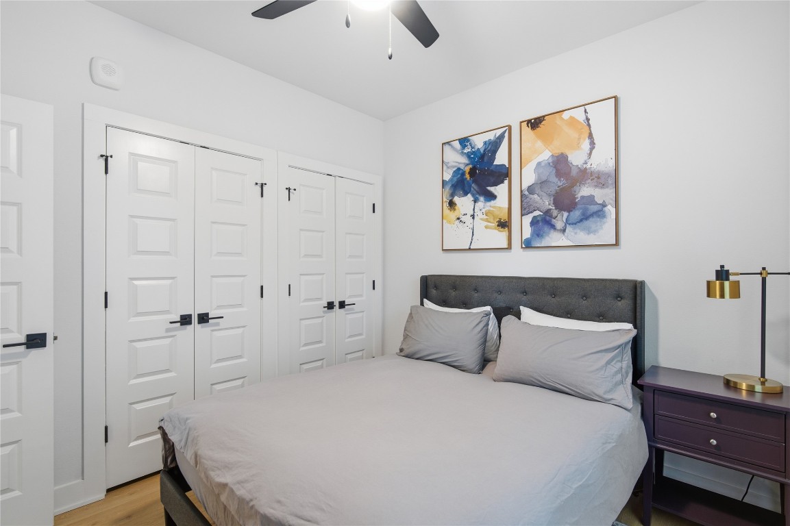 2500 Longview Street, Unit 201 Austin, TX 78705 - Photo 11 of 40 a bedroom with a bed and a painting on the wall