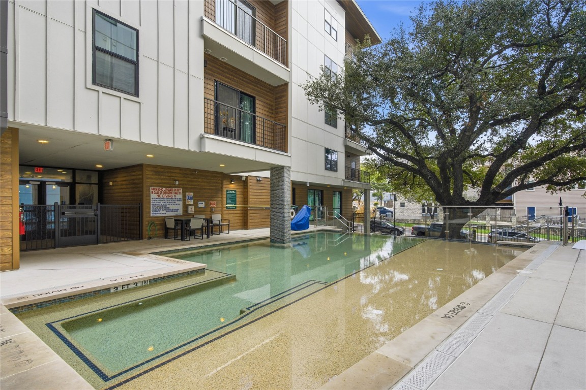 2500 Longview Street, Unit 201 Austin, TX 78705 - Photo 17 of 40 a view of a patio with swimming pool table and chairs