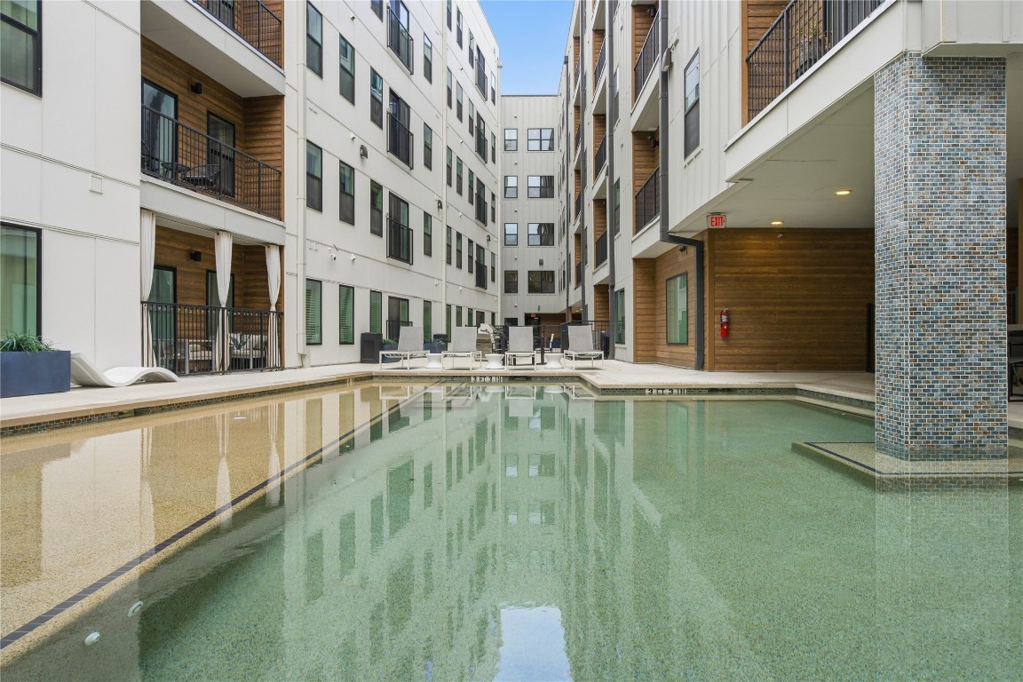 2500 Longview Street, Unit 201 Austin, TX 78705 - Photo 20 of 40 a view of an swimming pool with a balcony