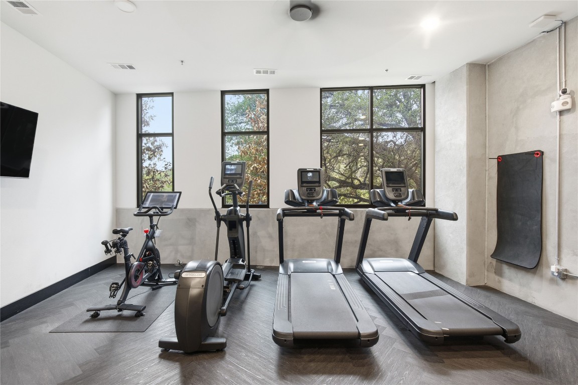 2500 Longview Street, Unit 201 Austin, TX 78705 - Photo 27 of 40 Exercise room featuring a wall of windows