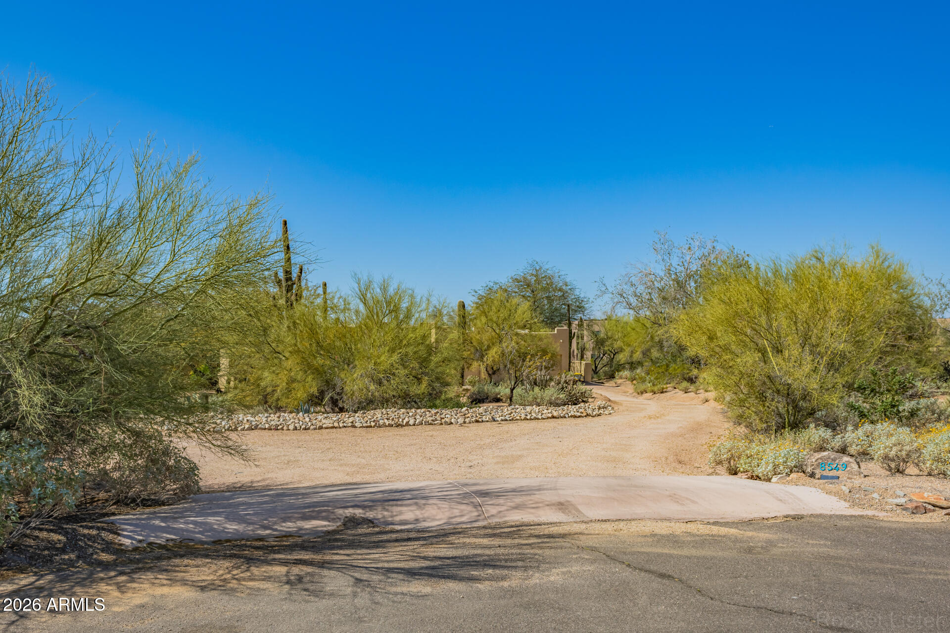 8549 East Bronco Trail Scottsdale, AZ 85255 - Photo 1 of 67 a view of a yard with a house