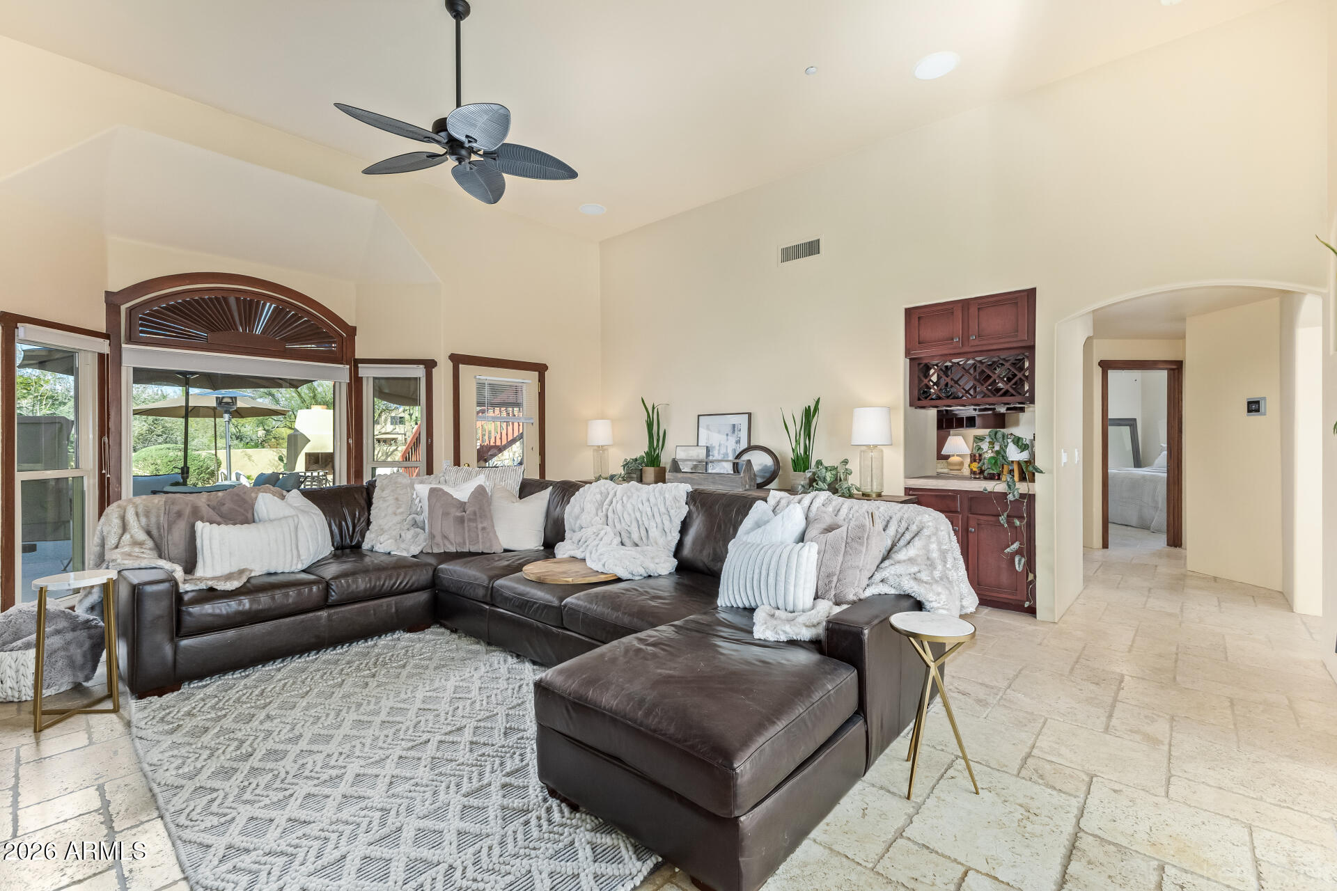 8549 East Bronco Trail Scottsdale, AZ 85255 - Photo 12 of 67 a living room with furniture and a large window