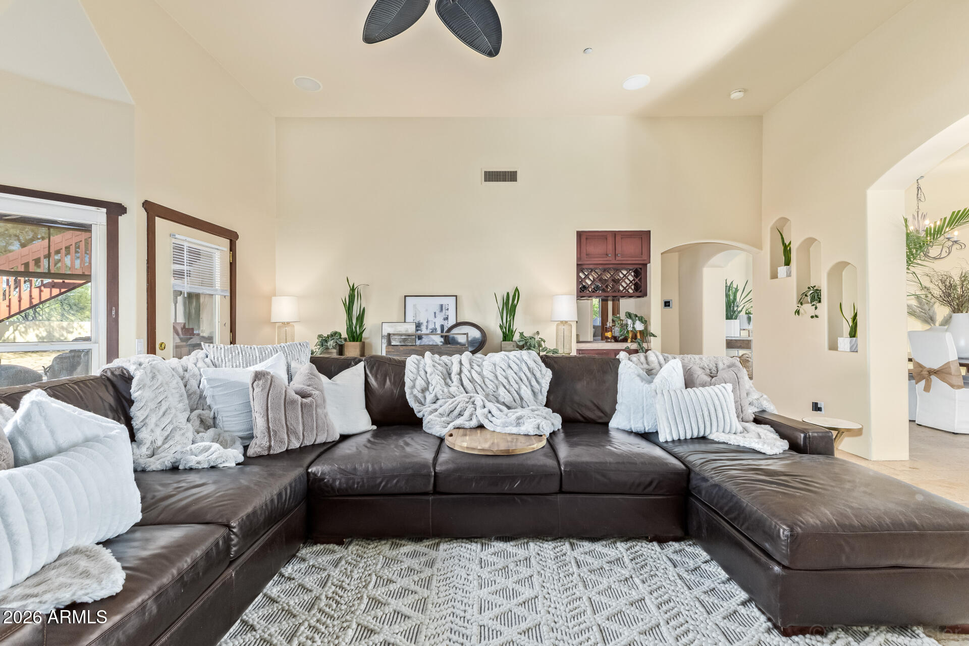 8549 East Bronco Trail Scottsdale, AZ 85255 - Photo 15 of 67 a living room with furniture and a couch