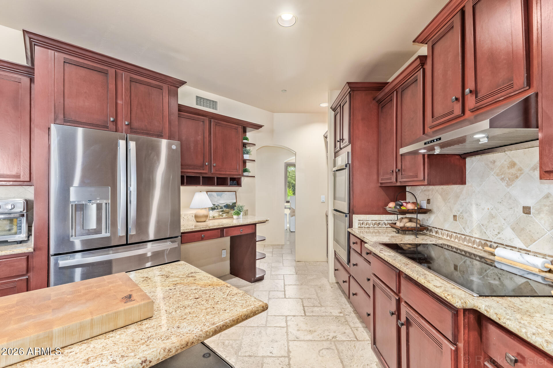 8549 East Bronco Trail Scottsdale, AZ 85255 - Photo 21 of 67 a kitchen with stainless steel appliances granite countertop a refrigerator stove microwave and sink