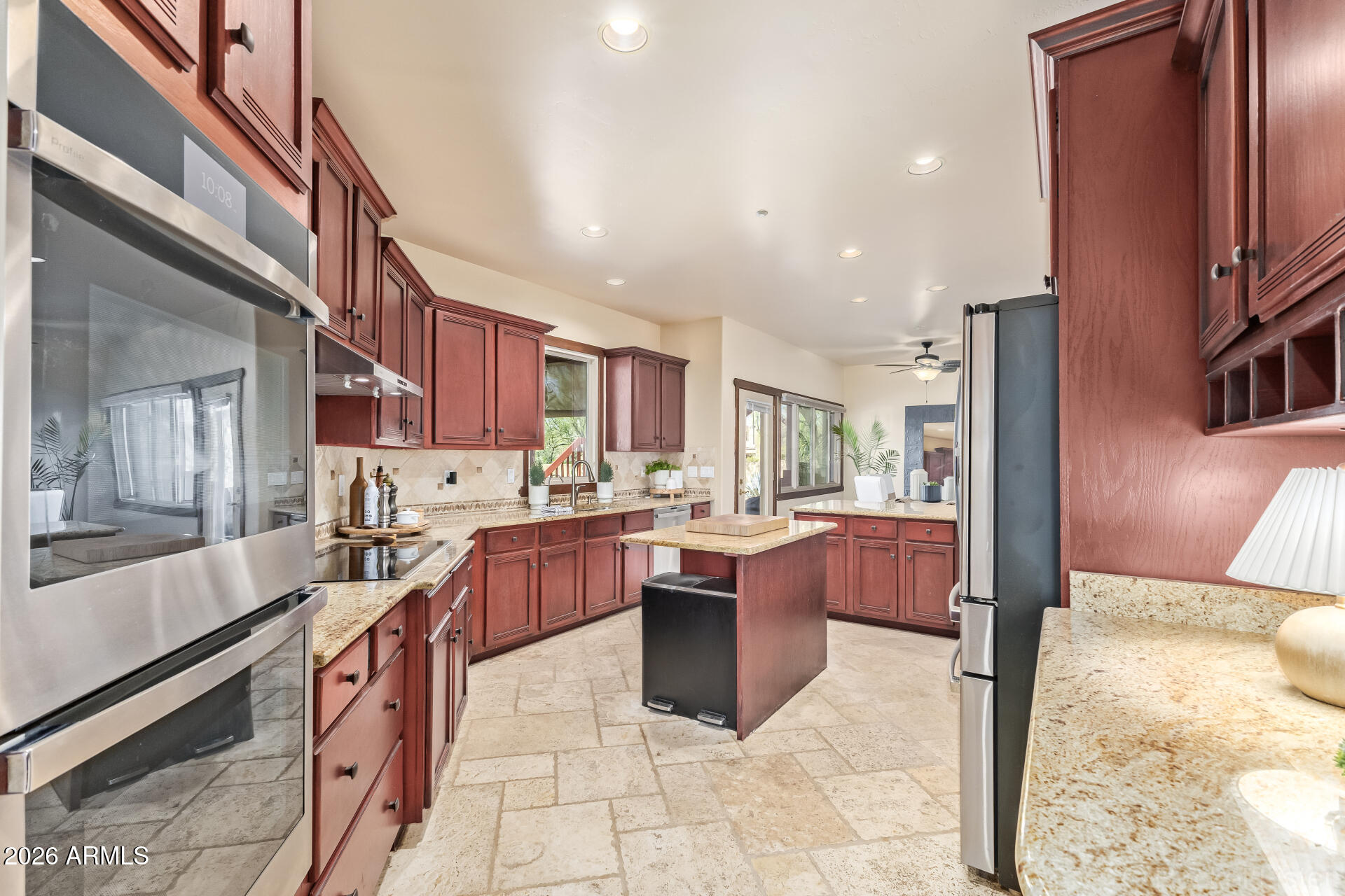 8549 East Bronco Trail Scottsdale, AZ 85255 - Photo 23 of 67 a large kitchen with stainless steel appliances lots of counter top space