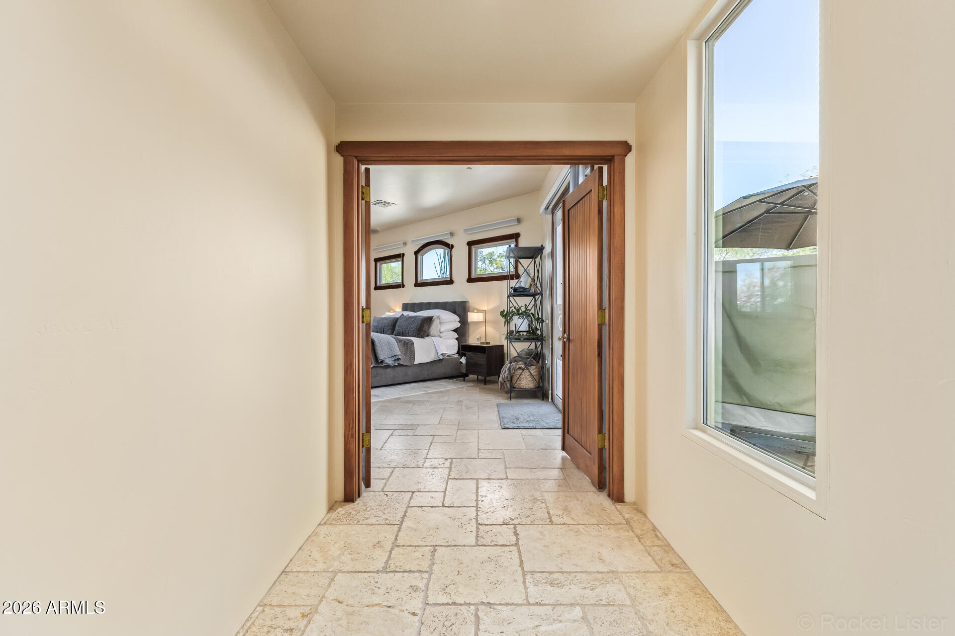 8549 East Bronco Trail Scottsdale, AZ 85255 - Photo 27 of 67 a view of a hallway with wooden floor and a living room