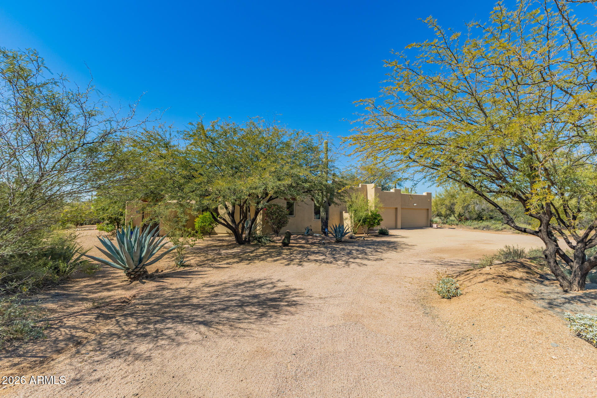 8549 East Bronco Trail Scottsdale, AZ 85255 - Photo 3 of 67 a view of a yard with plants and trees