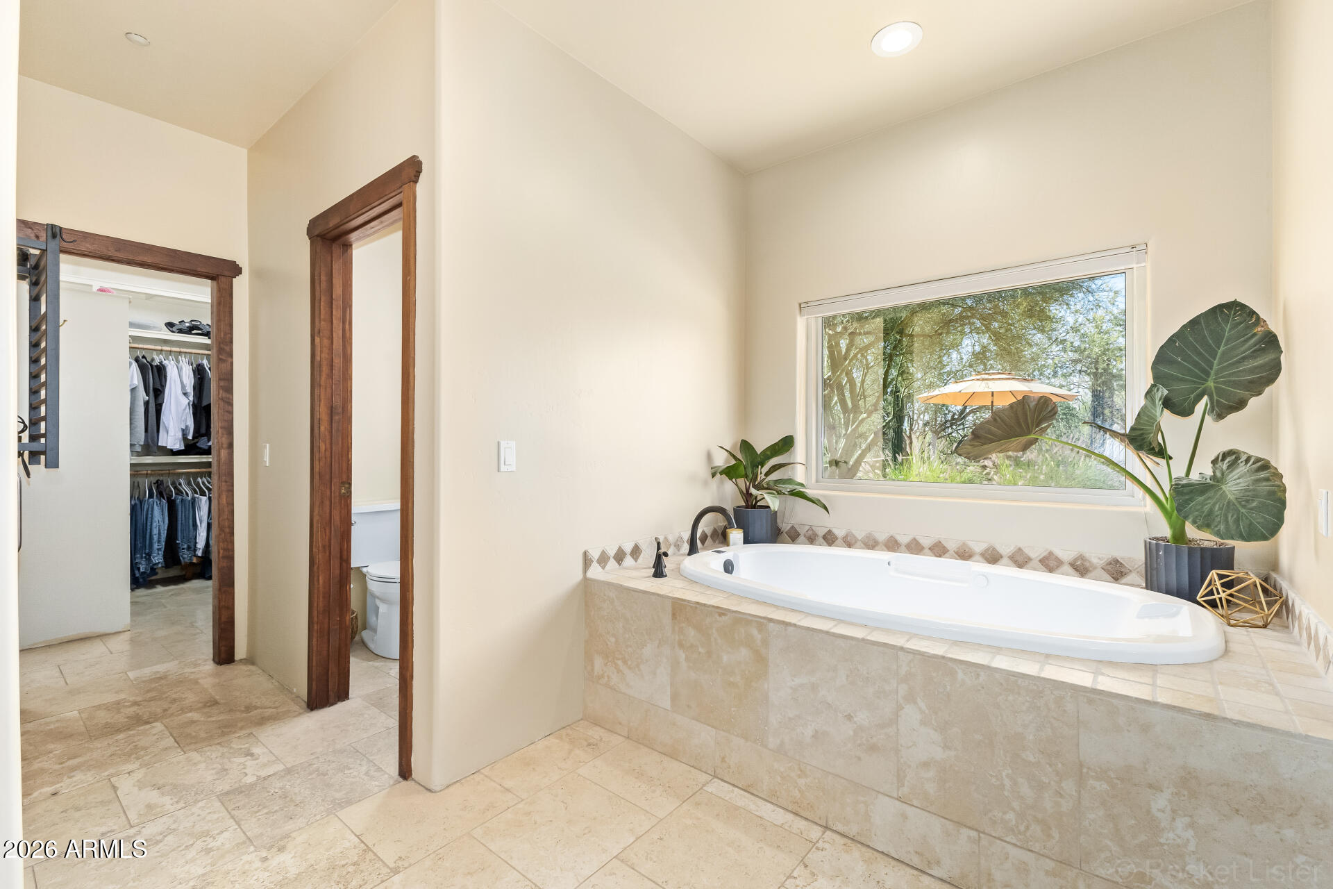 8549 East Bronco Trail Scottsdale, AZ 85255 - Photo 34 of 67 a spacious bathroom with a tub and shower