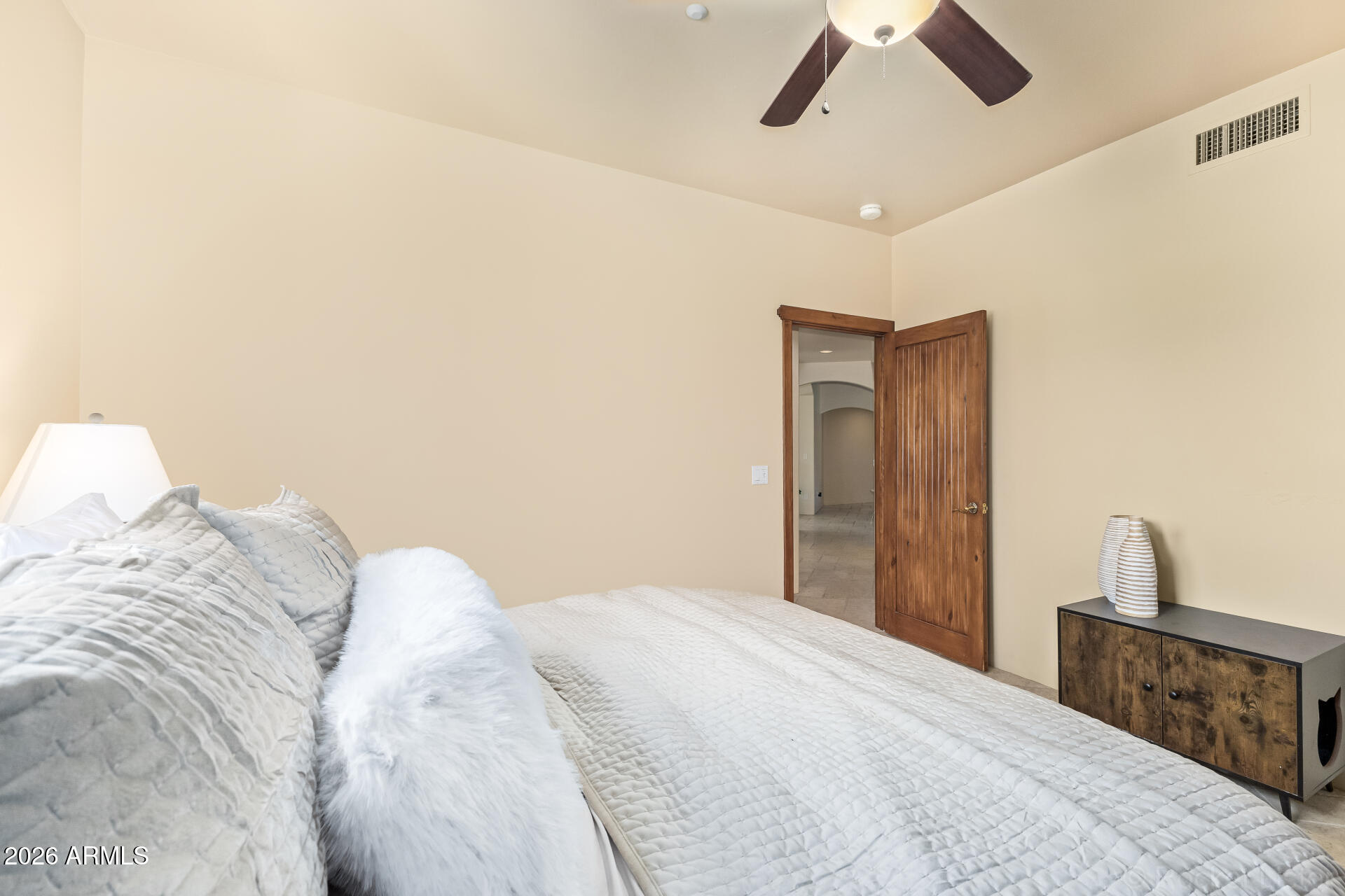 8549 East Bronco Trail Scottsdale, AZ 85255 - Photo 38 of 67 a bedroom with a bed and a painting on the wall