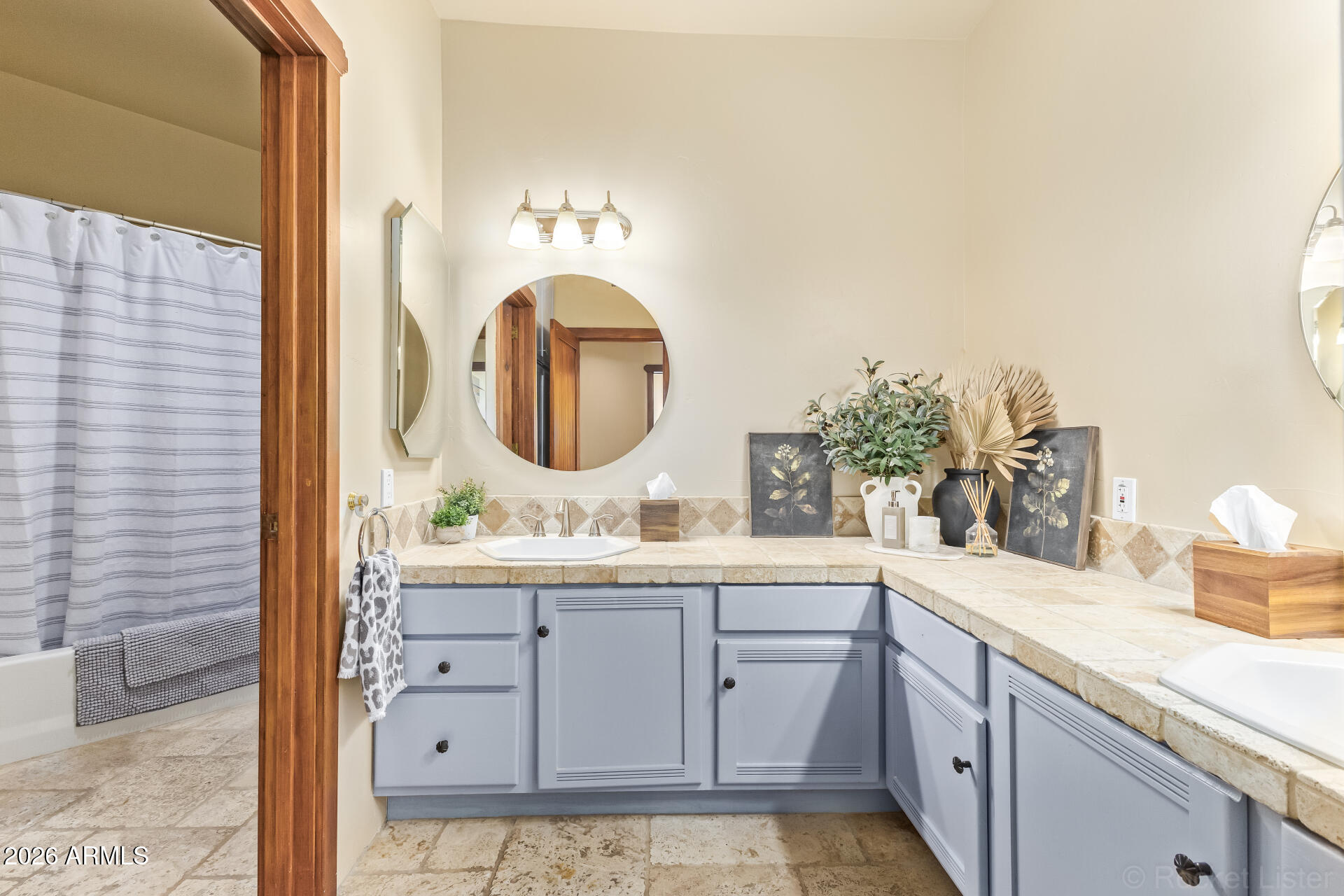8549 East Bronco Trail Scottsdale, AZ 85255 - Photo 43 of 67 a bathroom with a sink and a mirror