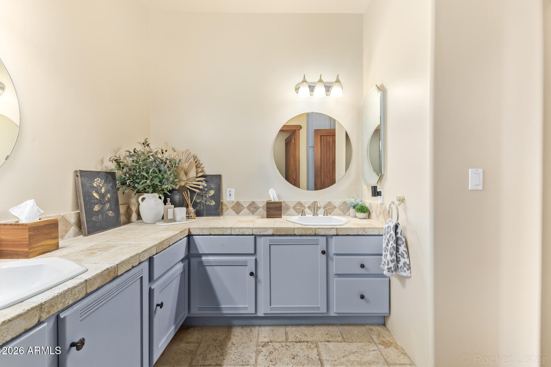 8549 East Bronco Trail Scottsdale, AZ 85255 - Photo 44 of 67 a bathroom with a sink and a mirror