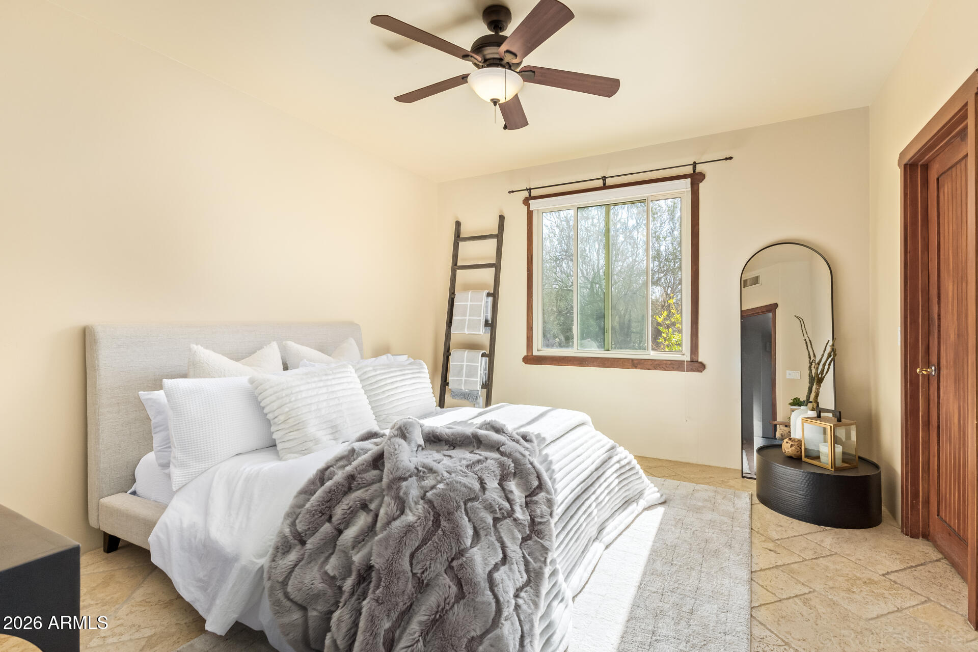 8549 East Bronco Trail Scottsdale, AZ 85255 - Photo 46 of 67 a bed sitting in a bedroom next to a window