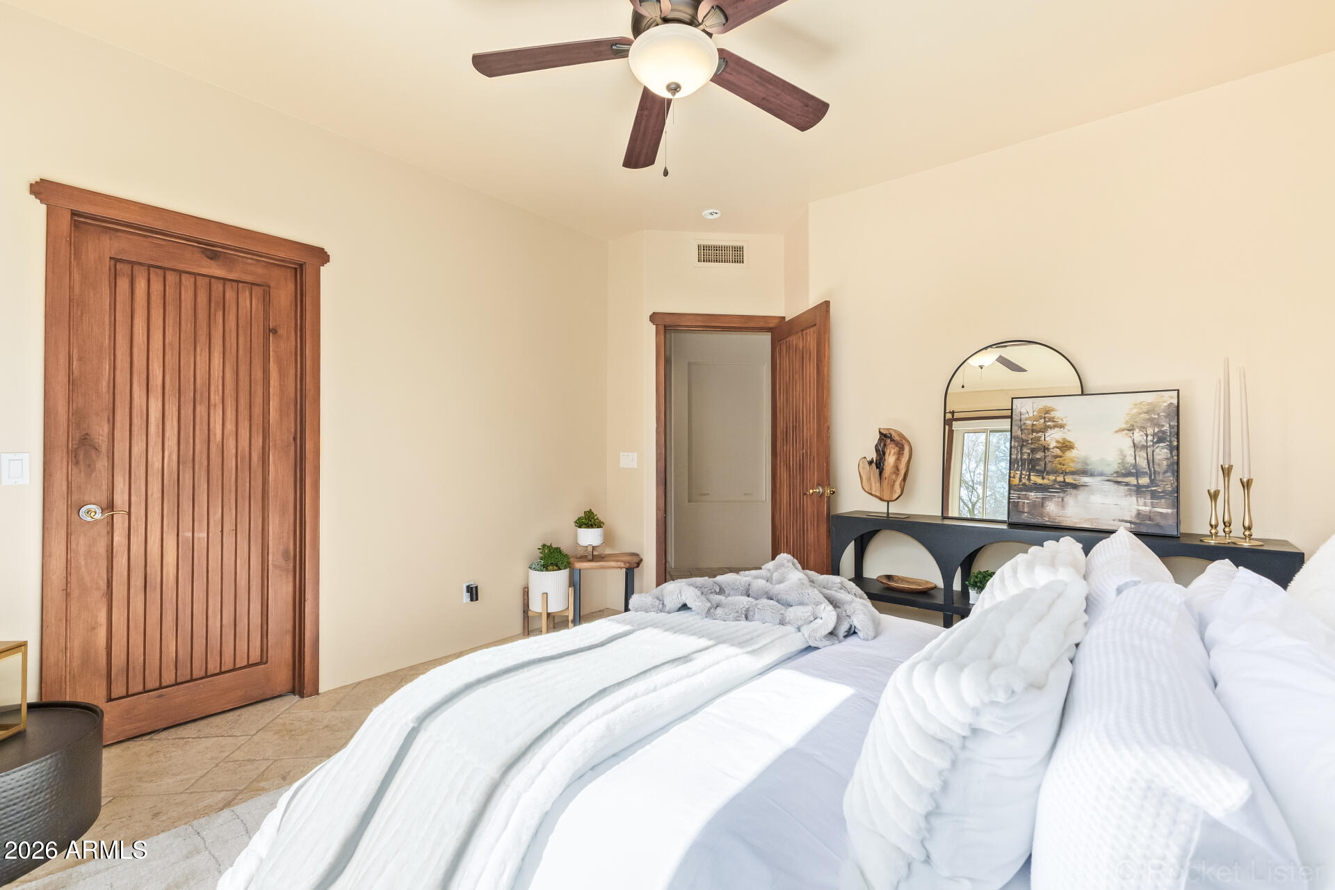8549 East Bronco Trail Scottsdale, AZ 85255 - Photo 47 of 67 a bedroom with a bed and a chandelier