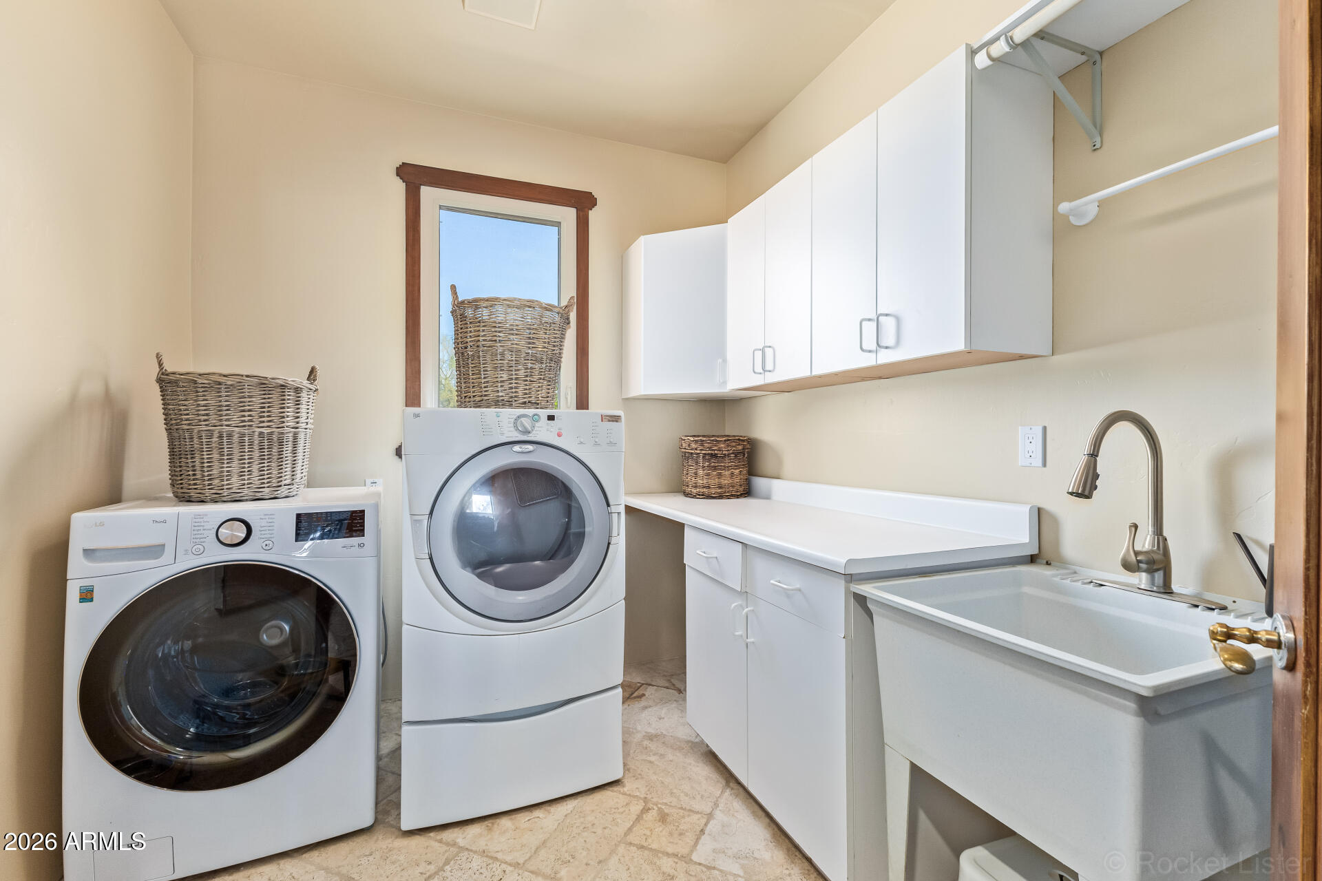 8549 East Bronco Trail Scottsdale, AZ 85255 - Photo 49 of 67 a utility room with sink dryer and washer