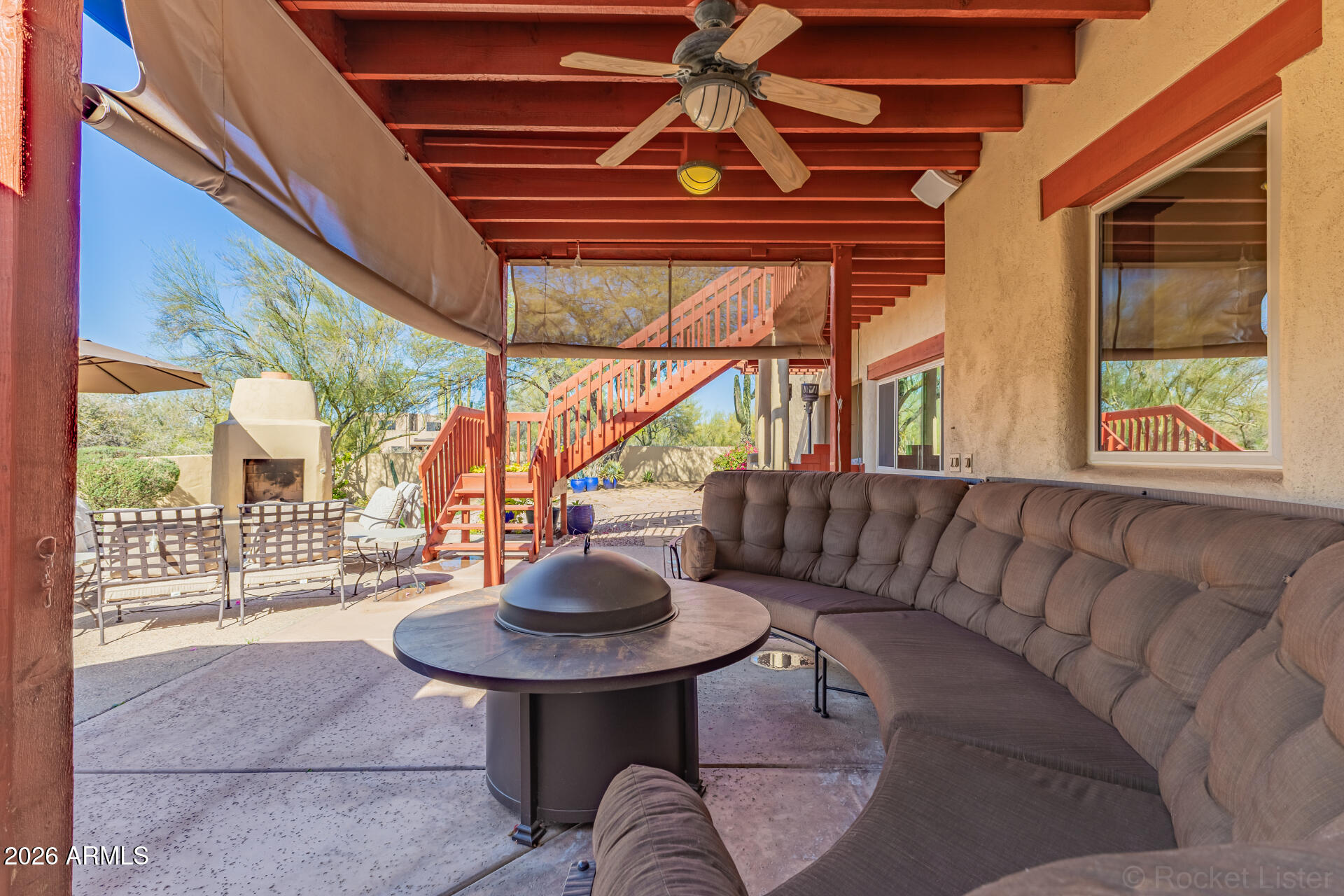 8549 East Bronco Trail Scottsdale, AZ 85255 - Photo 55 of 67 a living room with furniture and a window