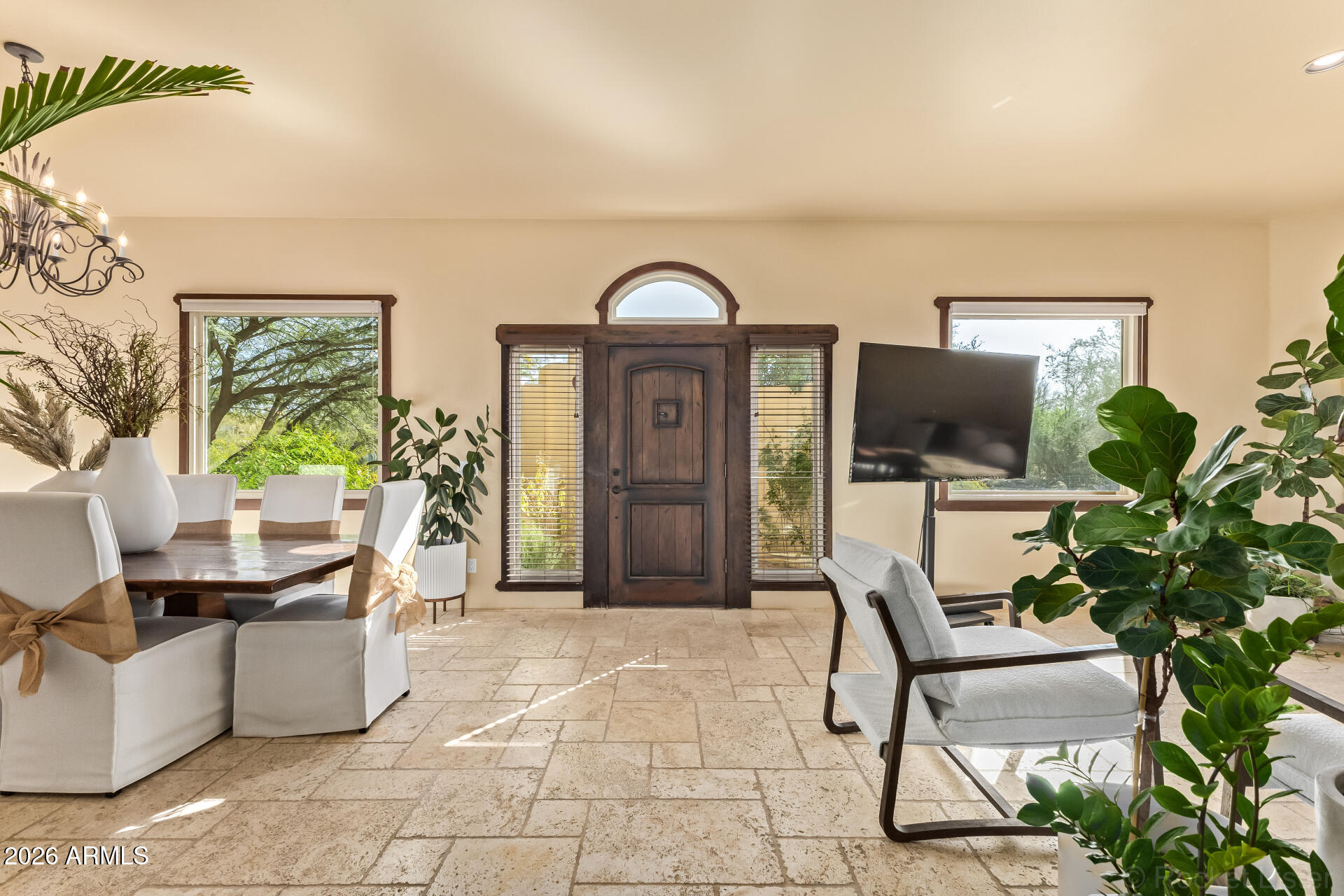 8549 East Bronco Trail Scottsdale, AZ 85255 - Photo 6 of 67 a workspace with furniture and a potted plant