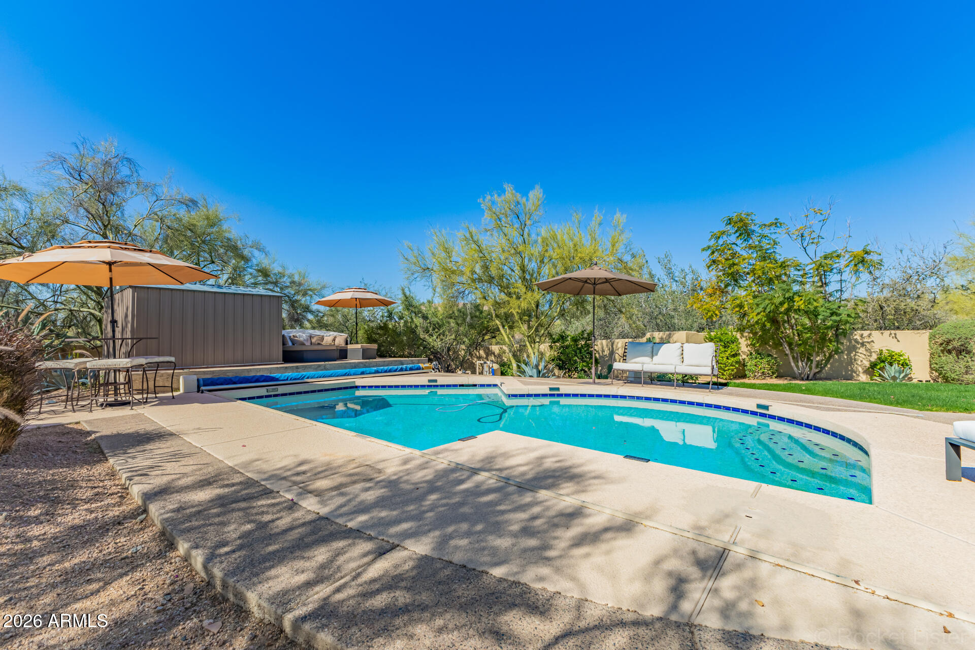 8549 East Bronco Trail Scottsdale, AZ 85255 - Photo 61 of 67 a swimming pool with outdoor seating and yard