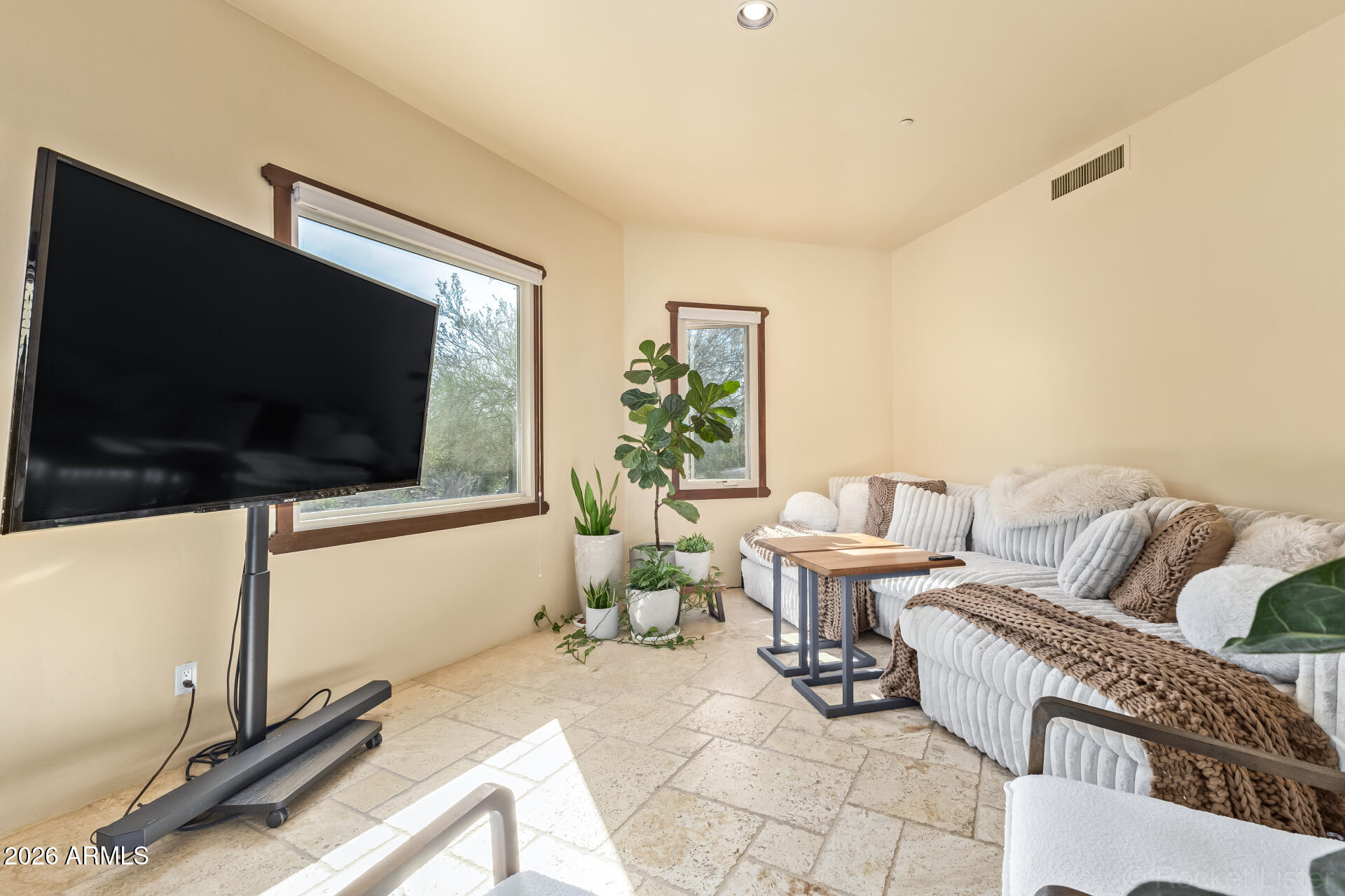 8549 East Bronco Trail Scottsdale, AZ 85255 - Photo 7 of 67 a living room with furniture and a flat screen tv