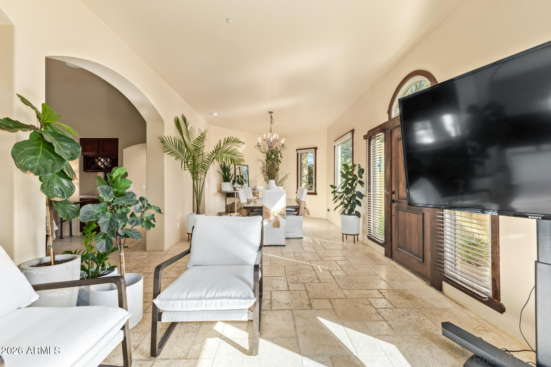 8549 East Bronco Trail Scottsdale, AZ 85255 - Photo 9 of 67 a living room with furniture and a flat screen tv