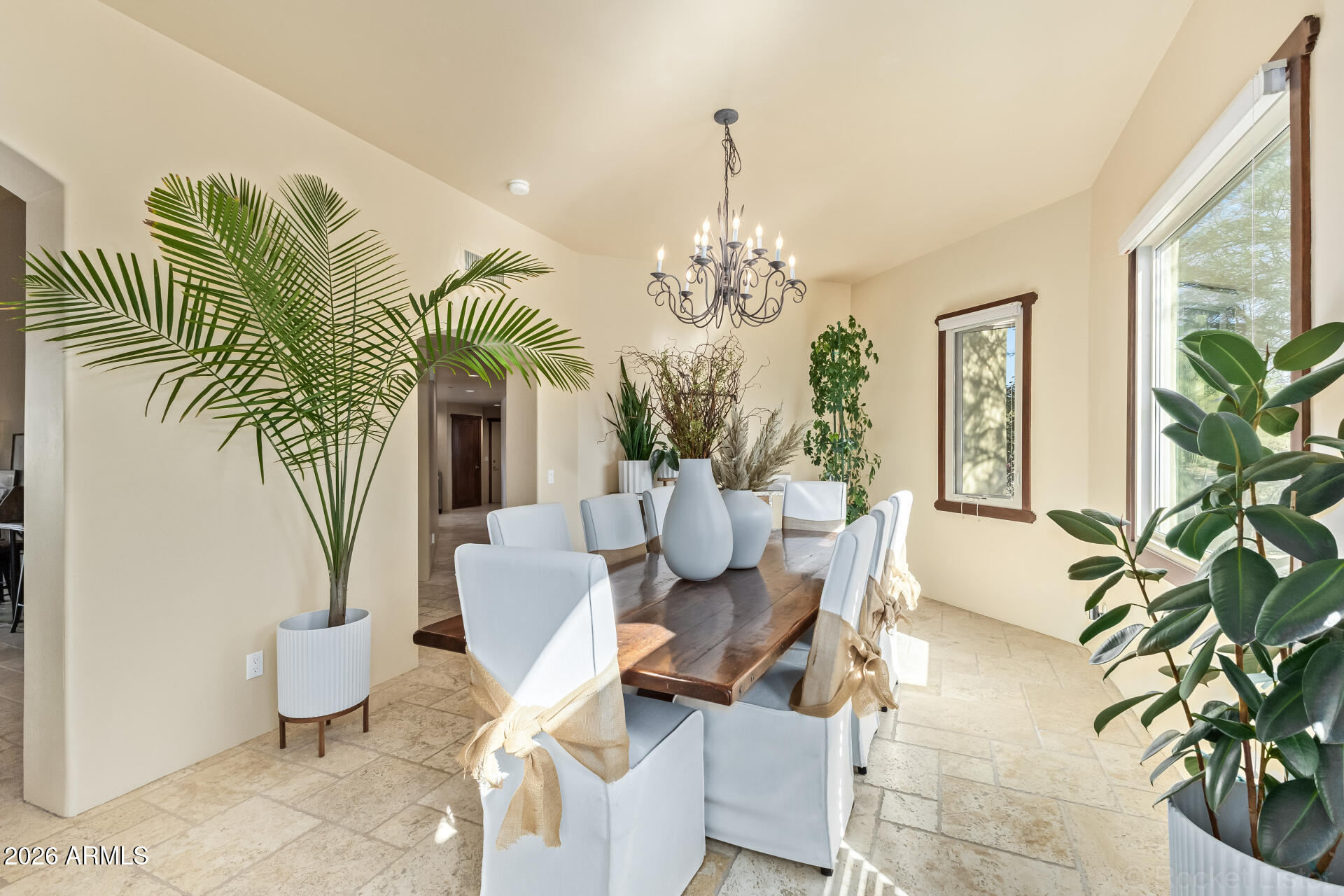 8549 East Bronco Trail Scottsdale, AZ 85255 - Photo 10 of 67 a living room with patio furniture and a chandelier