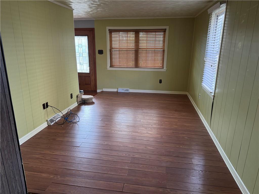 327 Rocktown Road Tarrs, PA 15688 - Photo 4 of 39 an empty room with wooden floor and windows