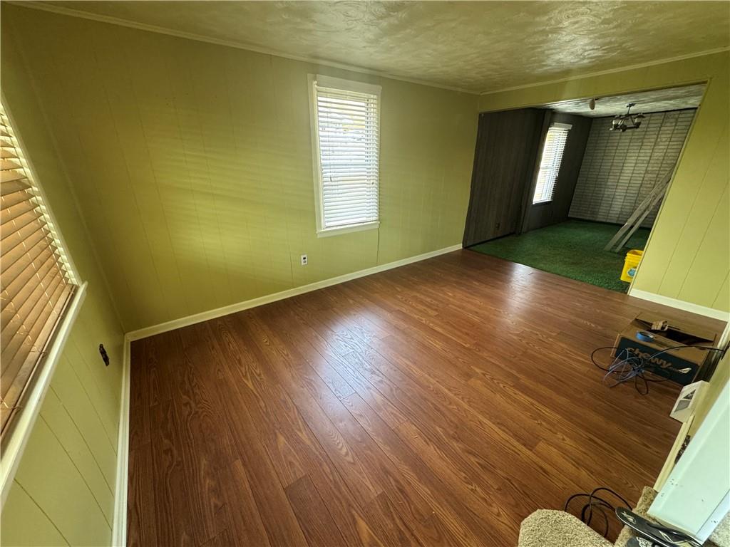 327 Rocktown Road Tarrs, PA 15688 - Photo 7 of 39 a view of an empty room with wooden floor and a window