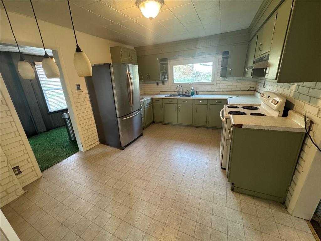 327 Rocktown Road Tarrs, PA 15688 - Photo 9 of 39 a kitchen with a refrigerator and a sink