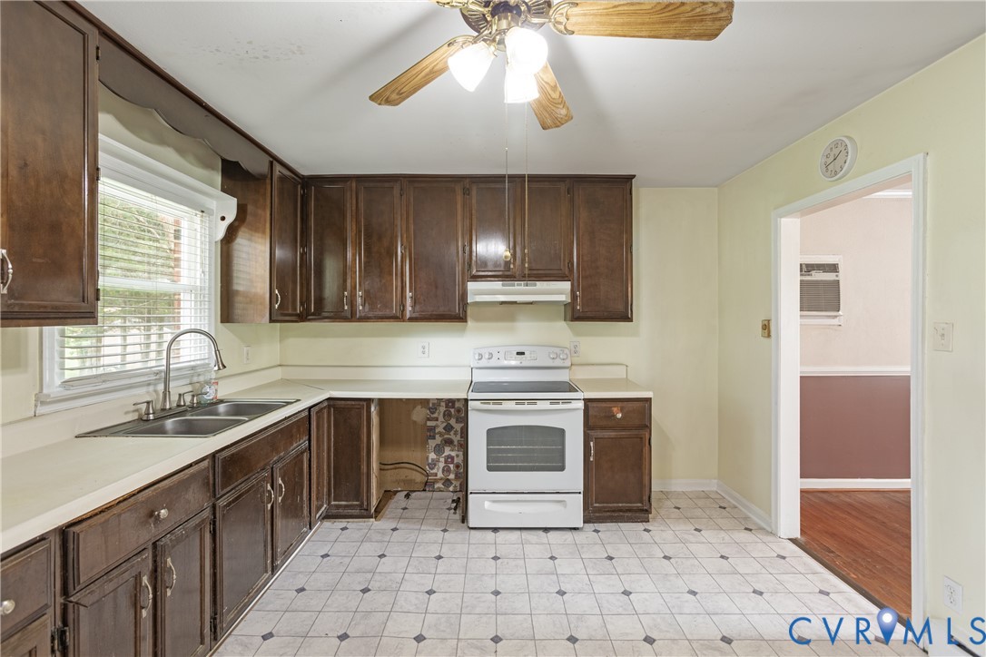 2730 Kinvan Road Henrico, VA 23231 - Photo 22 of 37 Kitchen with wood cabinetry, light-colored counter