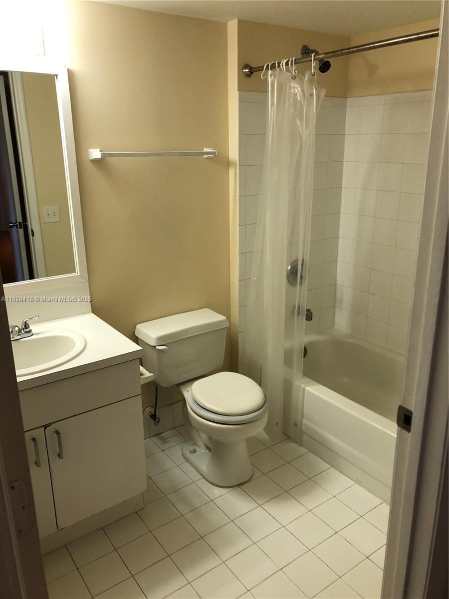 470 South Park Road, Unit 7308 Hollywood, FL 33021 - Photo 14 of 20 a bathroom with a sink a toilet and shower