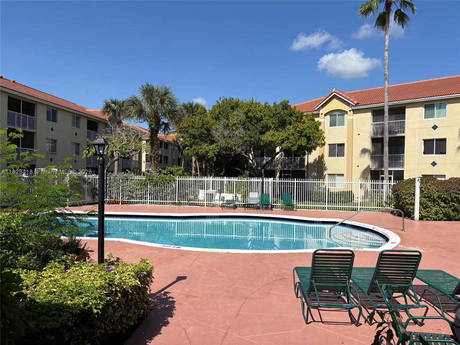 470 South Park Road, Unit 7308 Hollywood, FL 33021 - Photo 18 of 20 a view of swimming pool with seating space and plants
