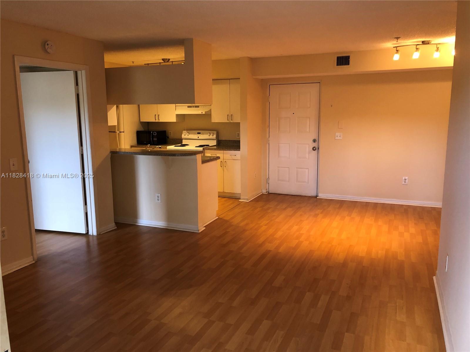 470 South Park Road, Unit 7308 Hollywood, FL 33021 - Photo 10 of 20 a view of kitchen with wooden floor and electronic appliances