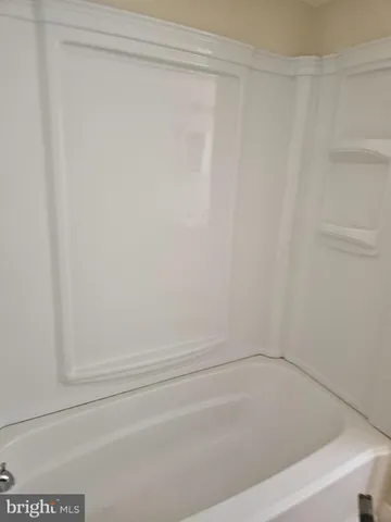 an empty room with a empty space and windows