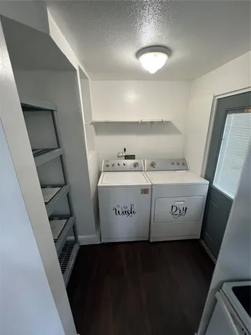a view of a room with washer and dryer