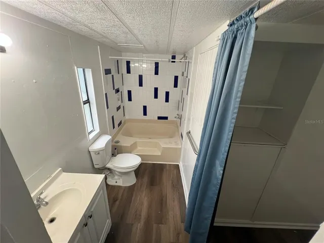 a bathroom with a sink and toilet