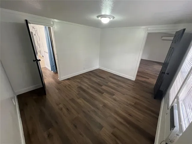 wooden floor in a hall with an entryway