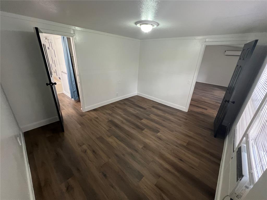 5195 Countryside Court St. Cloud, FL 34771 - Photo 9 of 20 wooden floor in a hall with an entryway