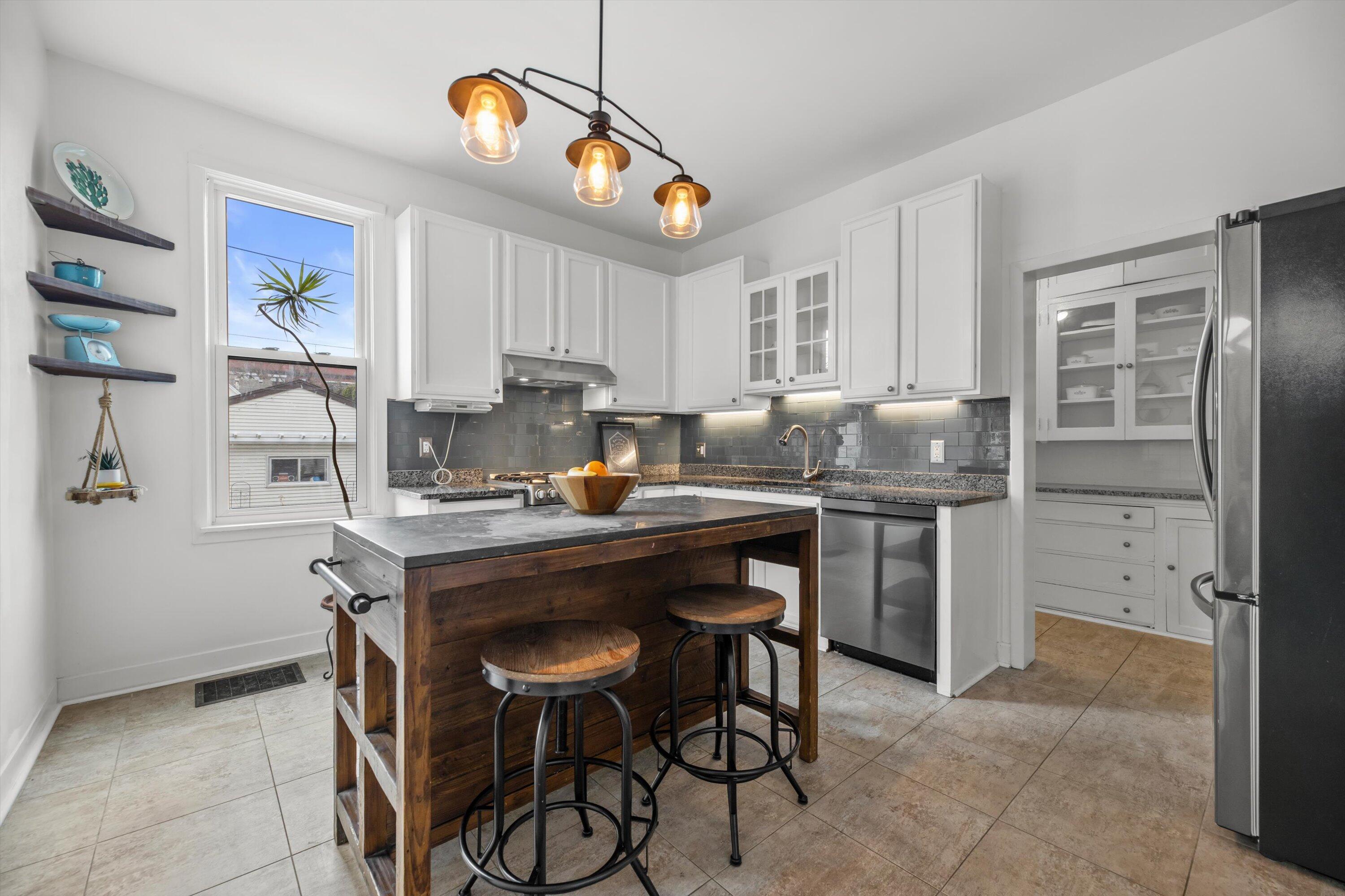 615 East Otjen Street Milwaukee, WI 53207 - Photo 19 of 63 Kitchen Island, Tile Floor, Stainless Steel Applainces