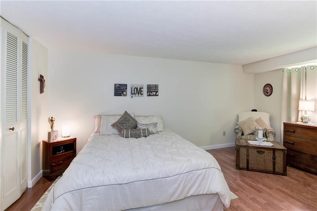 329 Ridge Point Circle, Unit 34B Bridgeville, PA 15017 - Photo 13 of 25 Down the hall from your living space, two spacious bedrooms feature more updated flooring and tasteful neutral paint.