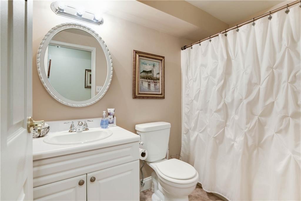 329 Ridge Point Circle, Unit 34B Bridgeville, PA 15017 - Photo 18 of 25 The shared bathroom features an updated vanity and shower/tub.