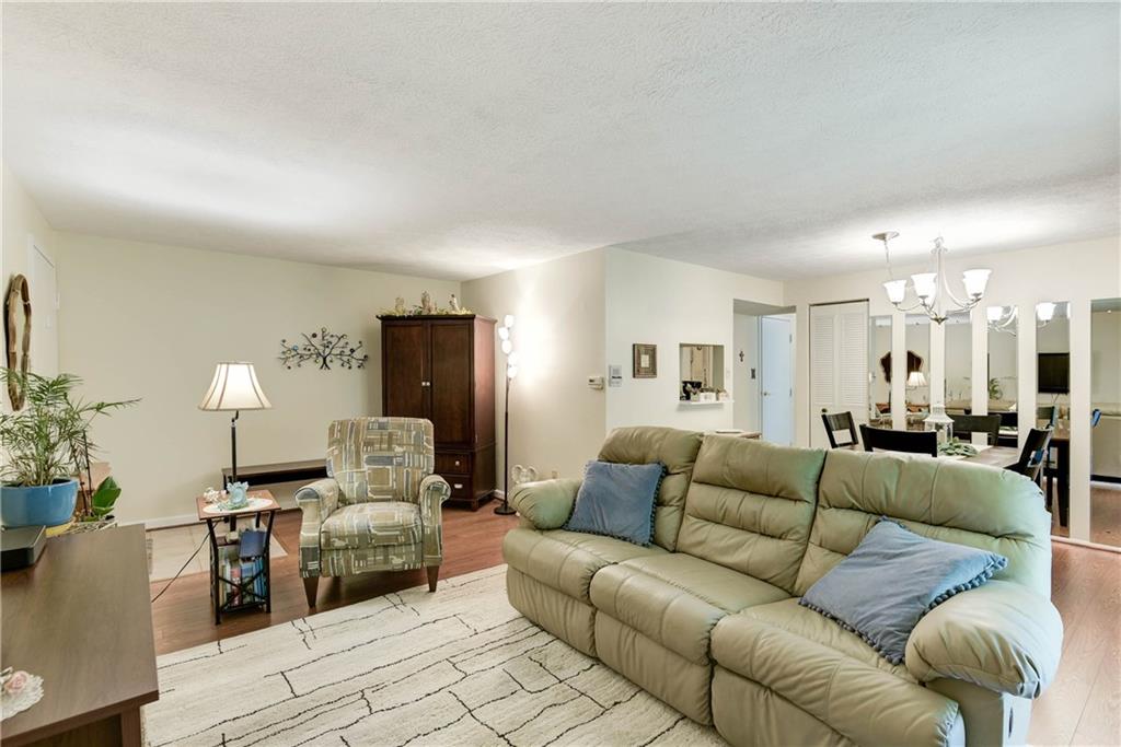 329 Ridge Point Circle, Unit 34B Bridgeville, PA 15017 - Photo 4 of 25 Unwind and entertain friends in the spacious living room!
