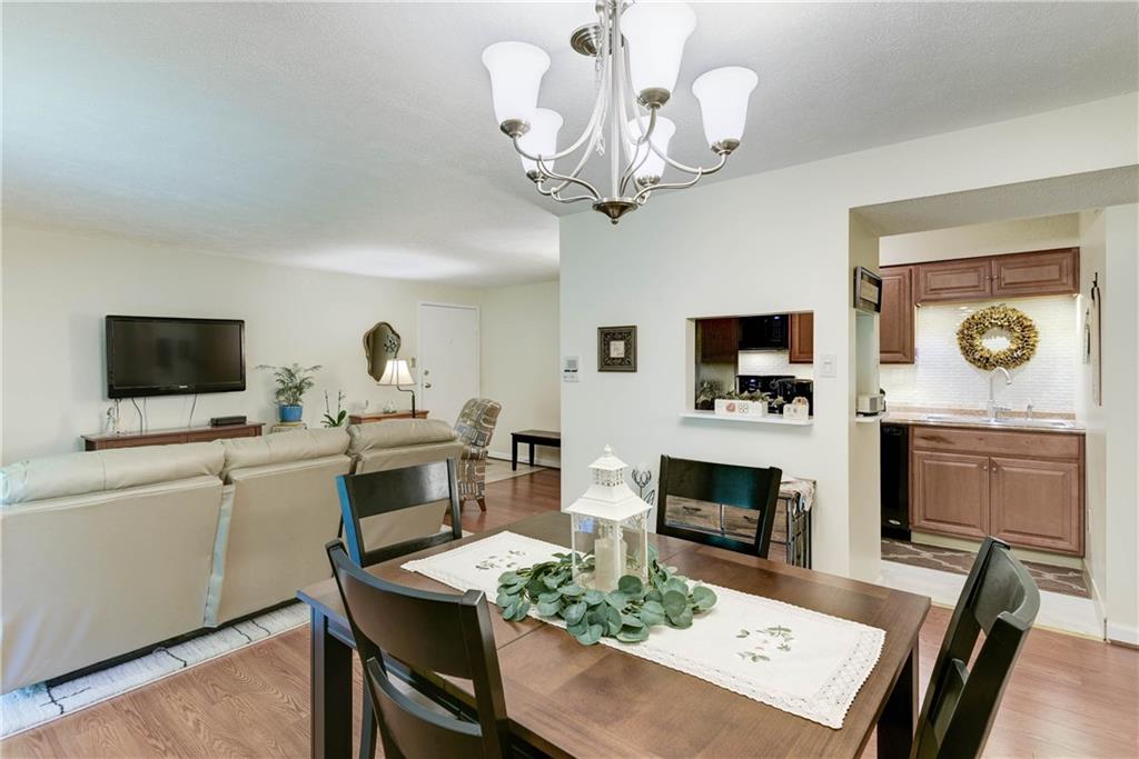 329 Ridge Point Circle, Unit 34B Bridgeville, PA 15017 - Photo 8 of 25 Entertaining is a breeze with an extra opening between the kitchen and dining room.