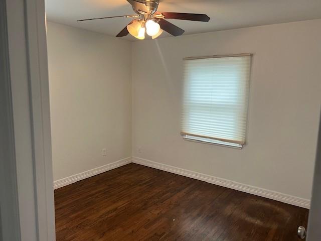 2211 Muret Street Irving, TX 75062 - Photo 13 of 16 a view of an empty room with wooden floor and a window