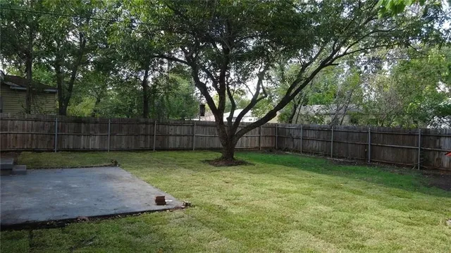 a view of a backyard with a trees
