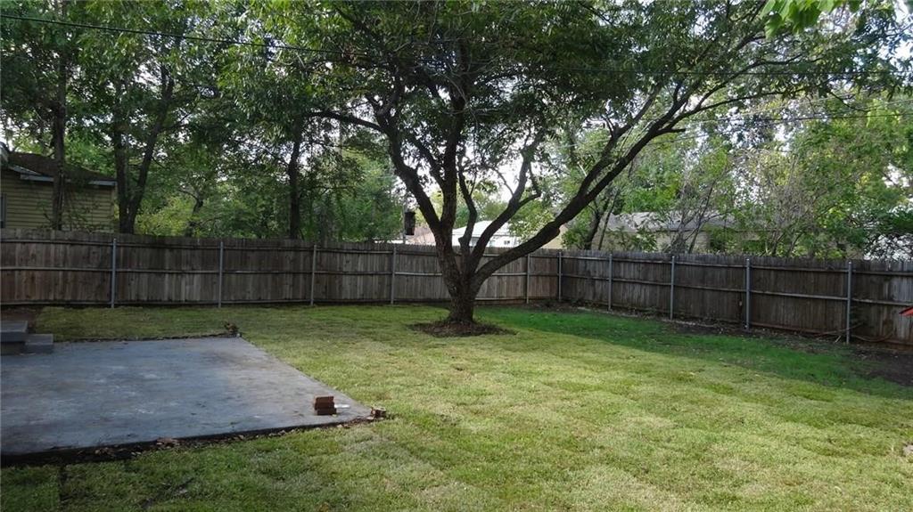 2211 Muret Street Irving, TX 75062 - Photo 15 of 16 a view of a backyard with a trees