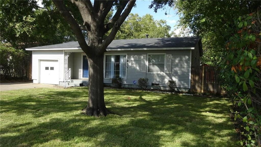 2211 Muret Street Irving, TX 75062 - Photo 2 of 16 a large tree in middle of the house