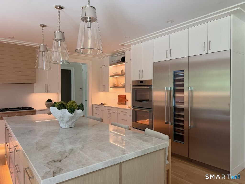 20 Fresenius Road Westport, CT 06880 - Photo 13 of 18 a kitchen with stainless steel appliances granite countertop a sink a refrigerator and a stove