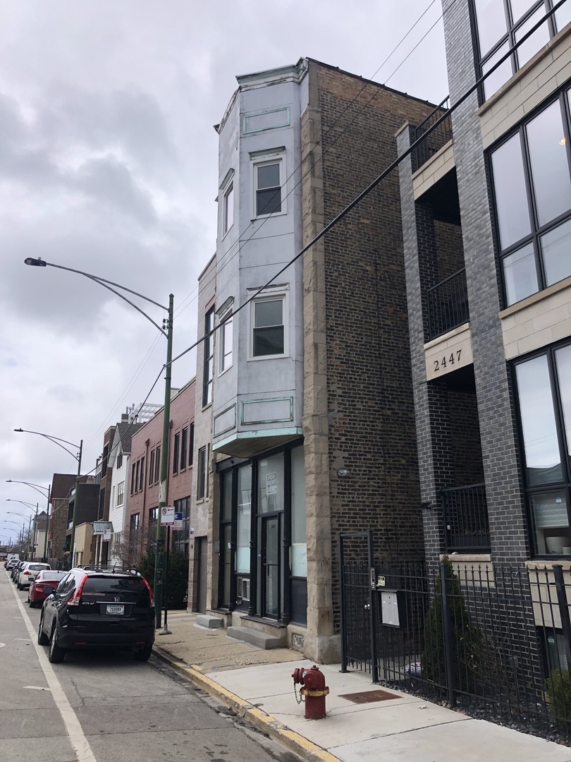 2449 North Clybourn Avenue, Unit 1 Chicago, IL 60614 - Photo 1 of 10 a view of a street that has couple of cars parked on the road