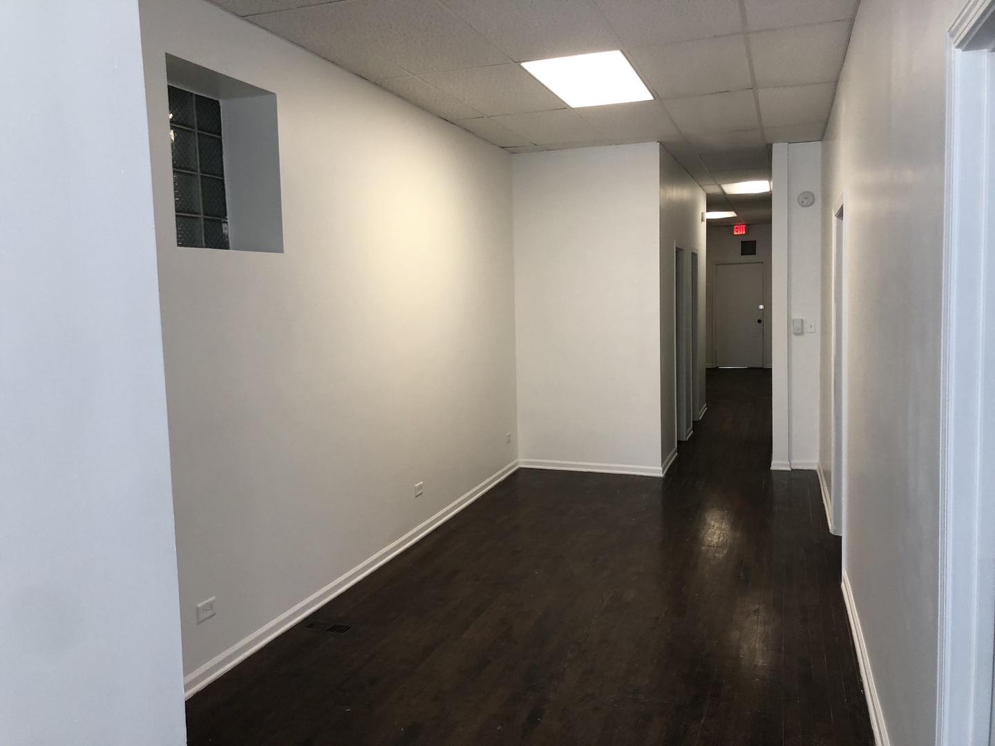 2449 North Clybourn Avenue, Unit 1 Chicago, IL 60614 - Photo 3 of 10 an empty room with wooden floor and closet