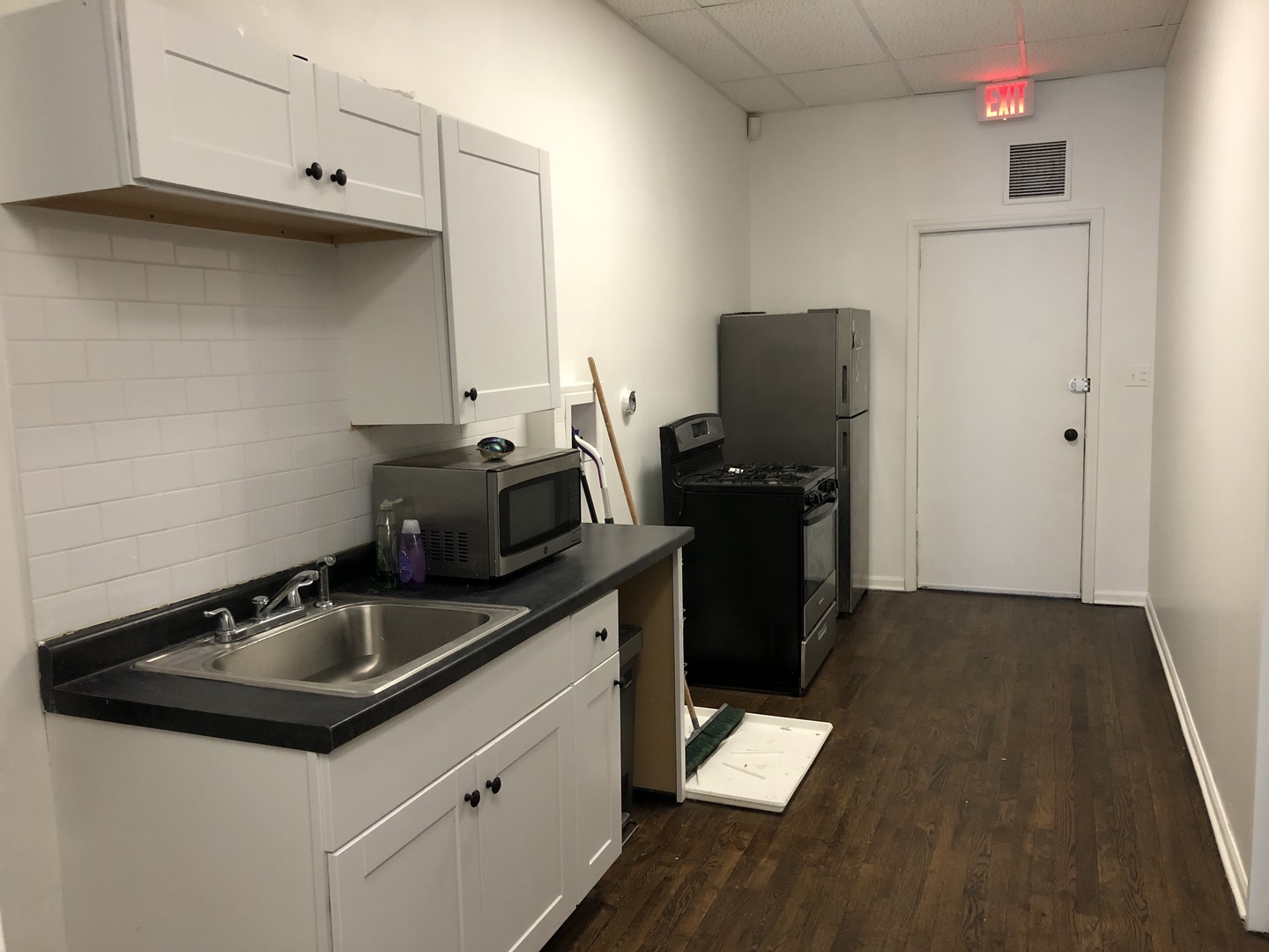 2449 North Clybourn Avenue, Unit 1 Chicago, IL 60614 - Photo 8 of 10 a kitchen with a sink and cabinets